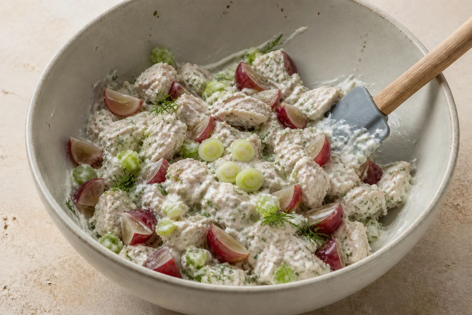 Greek yogurt dressing folded with chicken, celery, grapes, scallions and fresh herbs